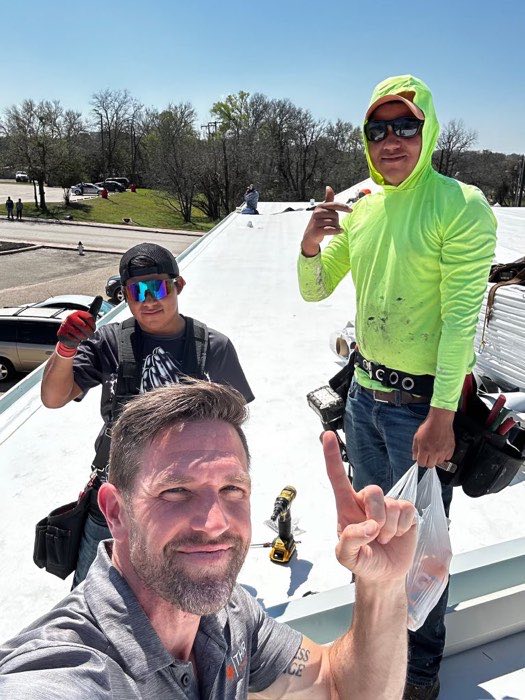 Daniel with roofing professionals in the field