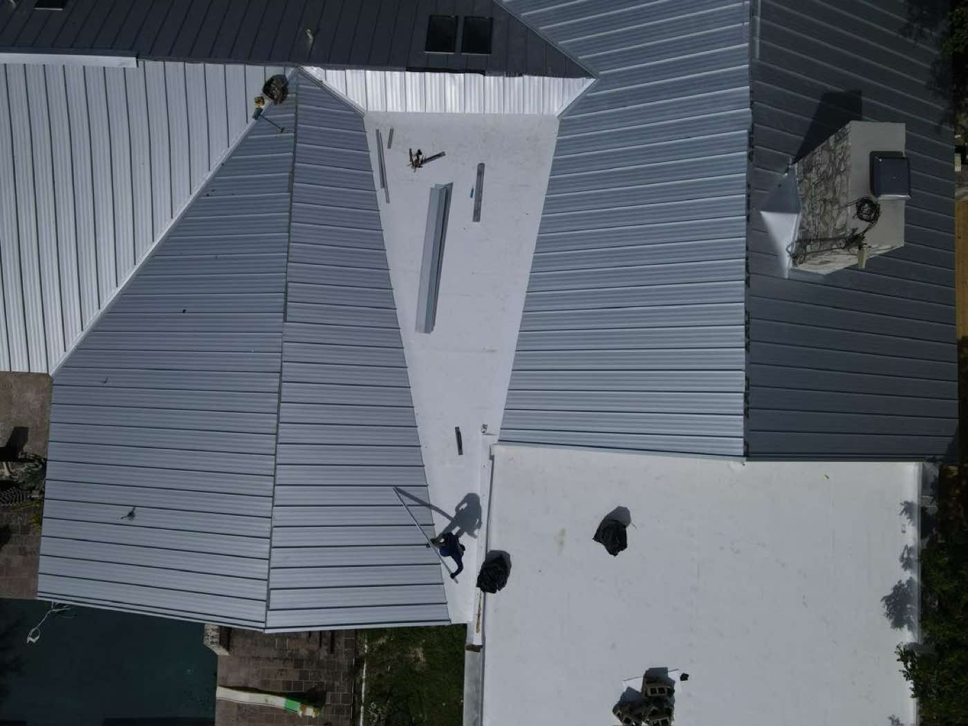 Aerial view of standing-seam metal roof panels and geometry